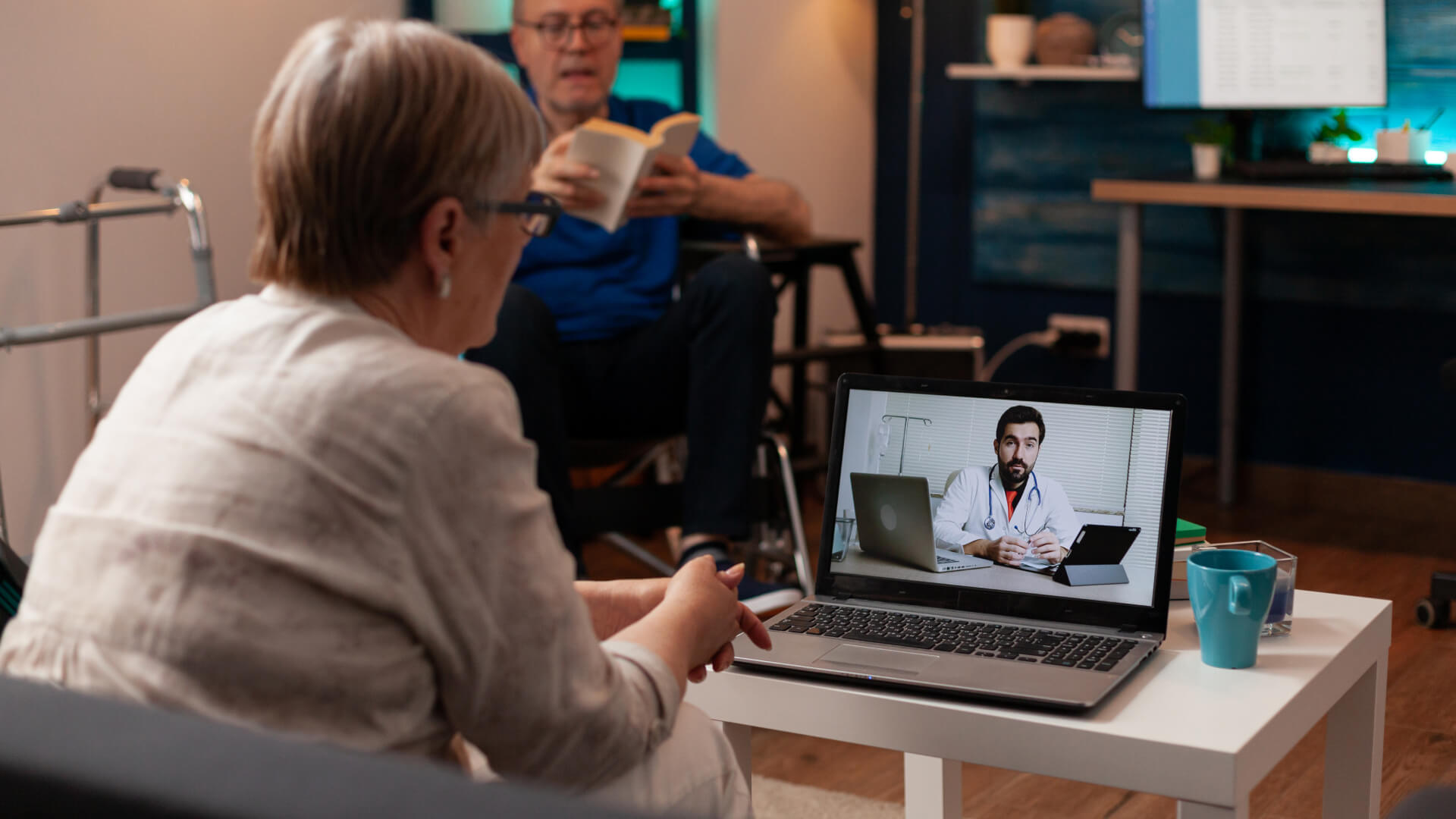 a patient on a video call with a doctor on a laptop